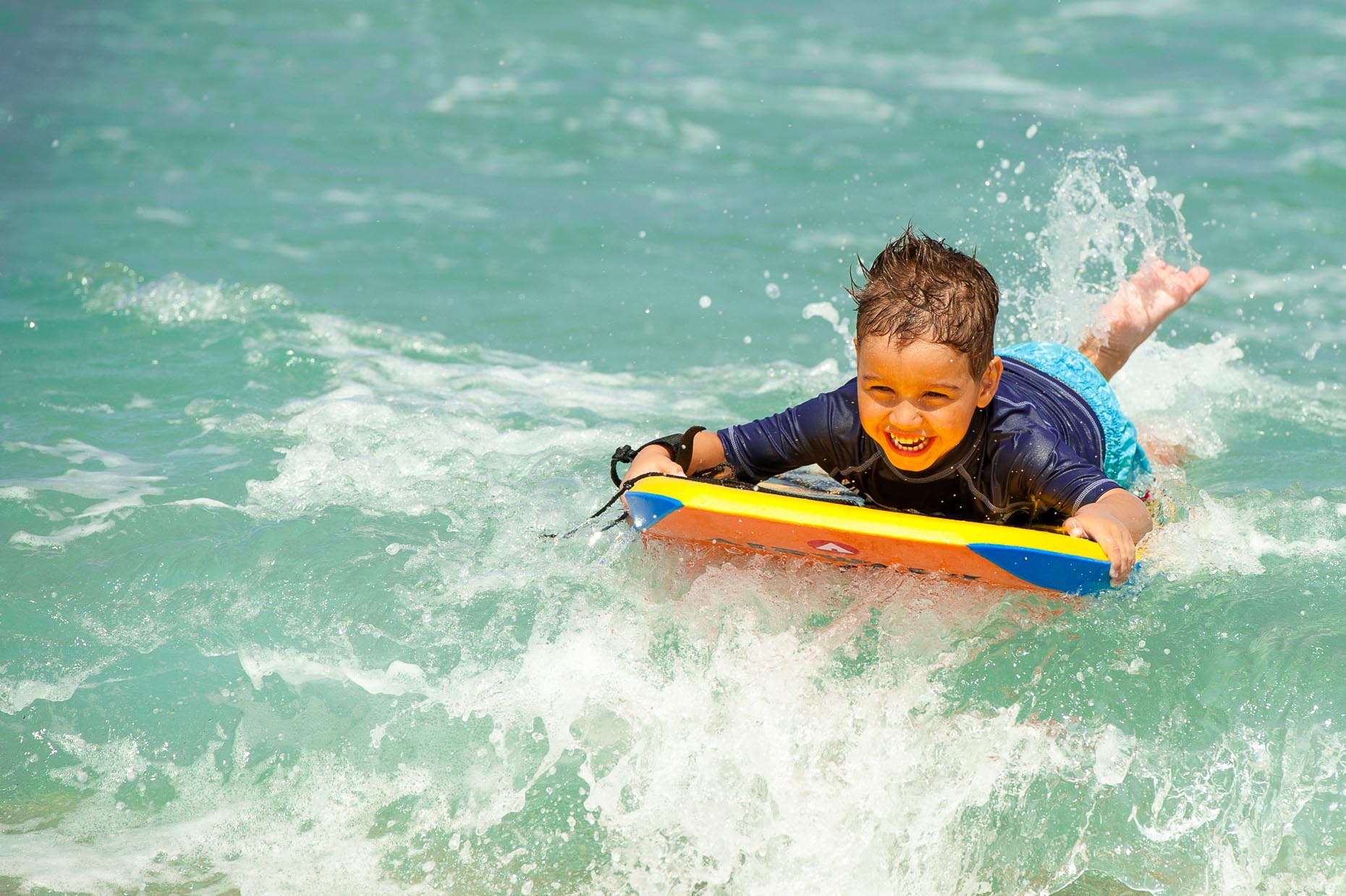 Litte boy Boogie Boarding at MacArthur Beach State Park, Florida
